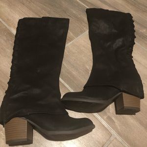 Below the knee fergie boots